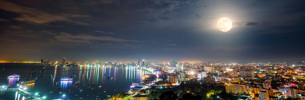 Full moon above Pattaya City at night, Thailand
